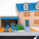 Frame of Animation from ING Financial Educational Animations showcasing a couple in front of a House with Pram